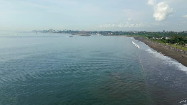 Padang Galak Beach Boat Drives Into Sanur Harbor Cloudy Day Bali Indonesia Drone Track In 4K 60FPS