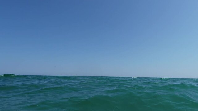 First Person View of a Man Swimming in the Ocean Water with Smartwatch