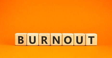 Burnout word symbol. Concept word Burnout on beautiful wooden blocks. Beautiful orange table orange...