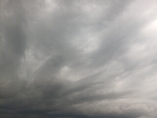 Fototapeta premium Dark moody overcast sky filled with heavy grey storm clouds before rainfall