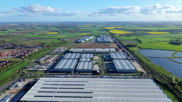 Panoramic aerial shot of major commercial freight hub and supply chain estate near Rossington England at dusk