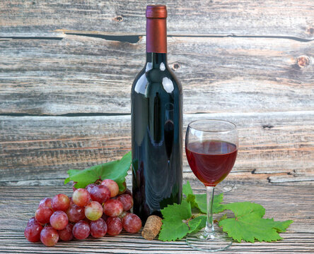 bottle of red wine and grapes