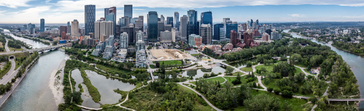 180&deg; panoramic aerial view of Downtown Calgary ( Alberta, Canada) with Prince&rsquo;s Island Park, Bow River, with Skyline and many skyscrapers build next to each other - Calgary suburbs in the background  