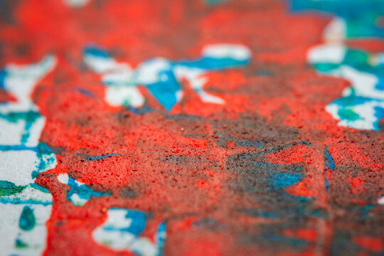 Extreme close up of colorful acrylic paint texture showing brush strokes. Selective focus.
