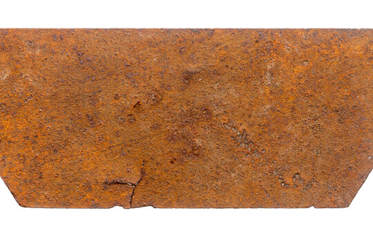Part of old unknown rusty object isolated on white background. The usual metal detecting find.