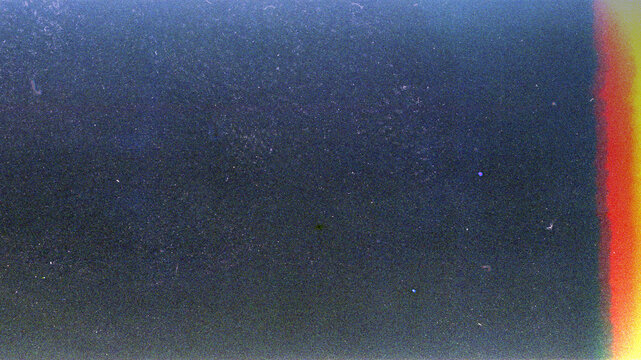 Blank grained film strip texture background with heavy grain, dust and light leak