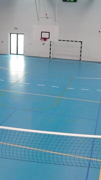 Empty school gymnasium with epoxy resin floor