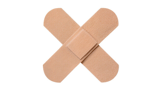 Two beige adhesive bandages crossed over each other, isolated on transparent background