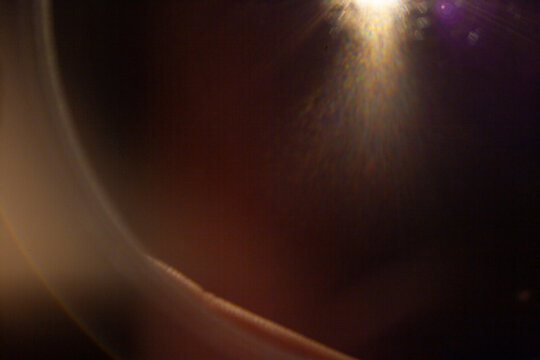 Sun flare on the black background