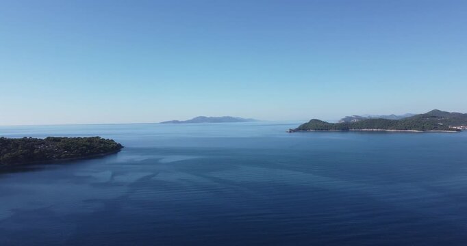 Aerial view of the island of Lopud, showing the forests and the village of Lopud, the islands of &Scaron;ipan and Ruda, and the blue Adriatic Sea on a sunny summer day; Lopud, Dubrovnik, Croatia.