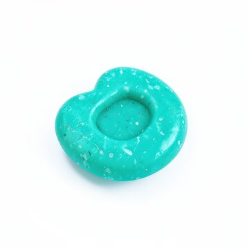 Turquoise worry stone with thumb indentation for stress relief and meditation, smooth comfort object on clean white background