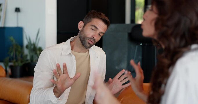 Frustrated couple, fight and argument with divorce on sofa for breakup, confession or conflict at home. Upset, man and woman with disagreement in dispute for toxic relationship or cheating affair