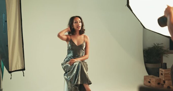 Smile, woman and photographer for photoshoot in studio, fashion campaign and production process. Model, posing and bts with photography catalog, magazine casting and filming set of creative industry
