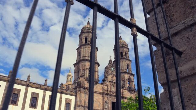 Basilica of Zapopan, a Marian shrine in Jalisco, Mexico, dedicated to the Virgin of Zapopan; a famous Catholic religious and tourist site&mdash;viewed with a leftward panning motion from outside the atrium.