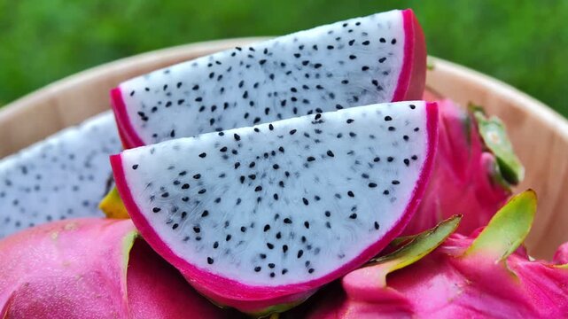 Ripe red dragon fruit placed in a bowl under natural light	