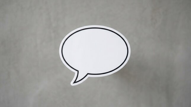 Blank white speech bubble with black outline on a textured gray background, ideal for adding text or graphics.