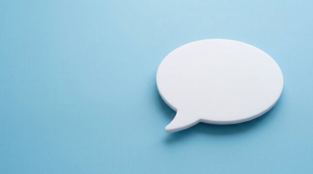 Blank white speech bubble on a pastel blue background, symbolizing communication, ideas, and empty thoughts.