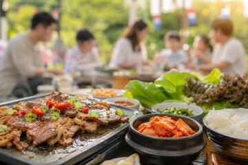 Obraz premium Korean family celebrating National Foundation Day with barbecue, kimchi and rice in a outdoor gathering.