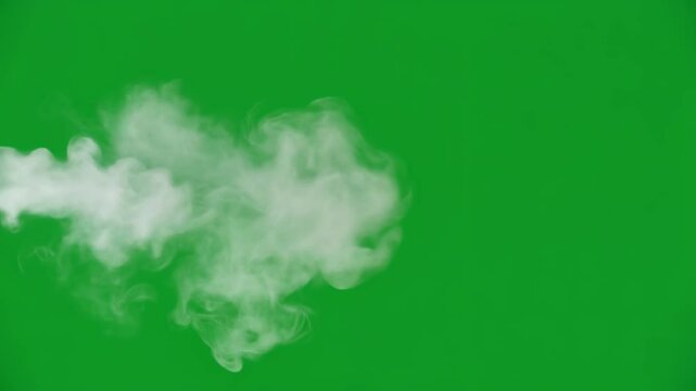 Premium isolated white smoke puff or steam cloud VFX element on green screen, ideal for professional video editing and compositing projects requiring special effects