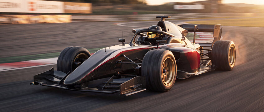 Race car speeding on circuit track during golden hour sunset, featuring sleek carbon fiber bodywork, gold wheels, and aerodynamic wings for motorsport editorial design