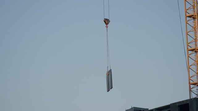 High-rise apartment building under construction with crane