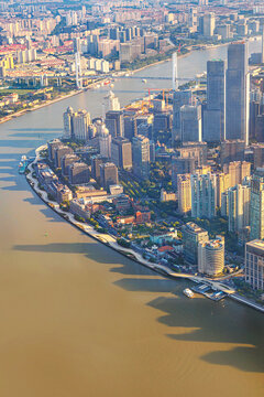 Shanghai, China, aerial cityscape of Shanghai at dusk from the Shanghai Tower, with modern skyscrapers rising above the Huangpu River in Pudong