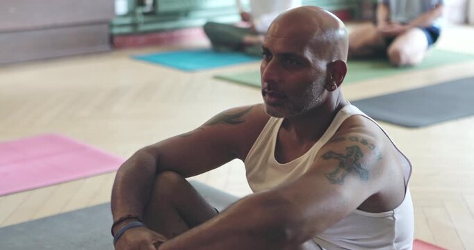 Fitness, yoga and a group of people in a class for health, wellness or awareness of inner peace and balance. Diversity, exercise or pilates training with men and women waiting to start their workout