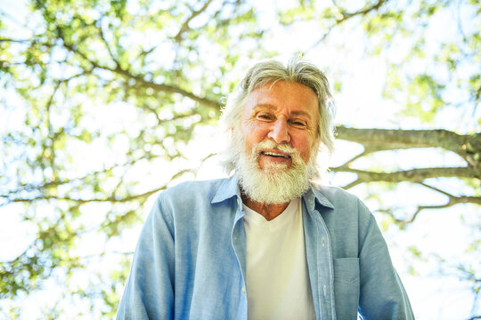 Senior man in the nice forest park