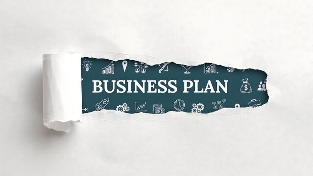 Business plan revealed through torn paper a concept for strategy growth and future success