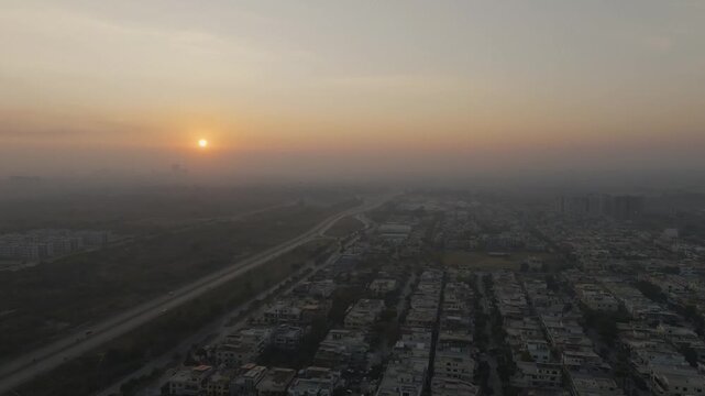 Aerial view of Margalla Road and Sector E-11 in Islamabad during hazy morning sunrise