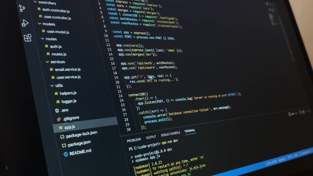 Professional developer scrolling and typing javascript code on a modern text editor, showcasing web programming, software engineering, and application development skills