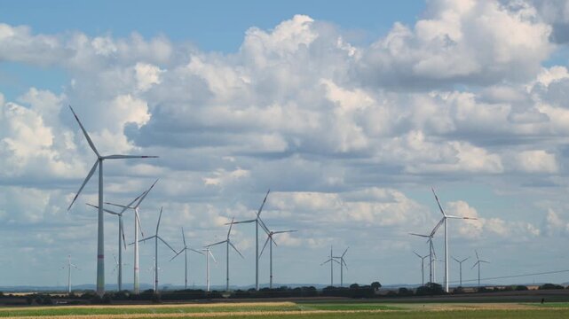 wind turbines in countryside in summer 4K