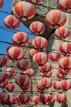 Low Angle View of Hanging Red and White Striped Japanese Paper Lanterns