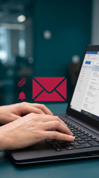 Hands typing on a laptop with email and notification icons, representing communication and digital interaction
