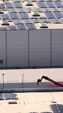 Solar panels installation on industrial building rooftop