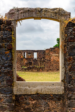 Window with a wall and stone frame in the ruins of the city of Alcantara, Maranhao.