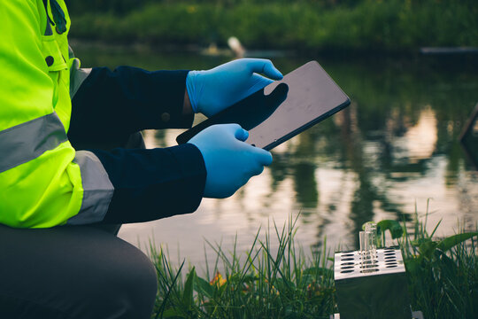Water source inspection with officials collecting samples collect information into the system.