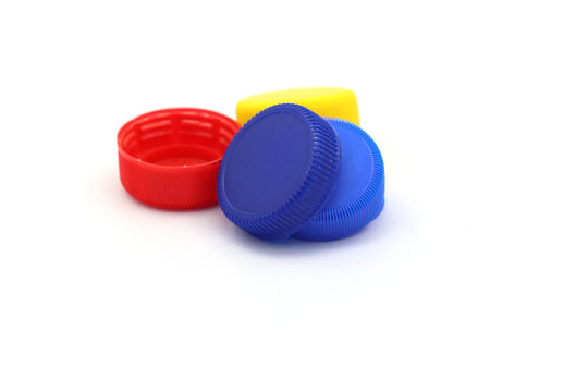 Recycling bottle caps on a white background.