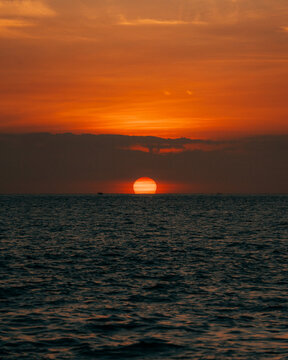 View of the sunset over the ocean at Gili Trawangan in Pemenang, West Nusa Tenggara, Indonesia.