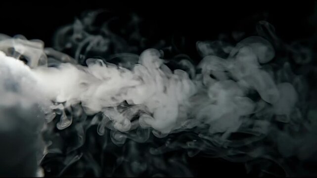 Subtle Gray Dry Ice Vapor Rolling on Pitch Black for Dramatic Transitions