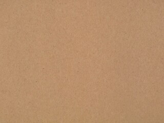 Smooth brown kraft paper texture surface background for design projects. Ideal stock image for eco-friendly packaging, rustic backdrop, crafting material, copy space, and stationery mockup concept