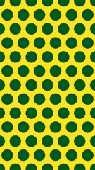 Vibrant yellow seamless background with dark green polka dots © Anonim