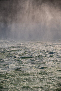 View of the turbulent water and mist at the Bonneville Dam in Cascade Locks, Oregon, United States.