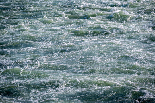 View of the turbulent, churning water of the Columbia River near the Bonneville Dam in Cascade Locks, Oregon, United States.