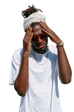 Man with dreadlocks and turban holding head in confusion, wearing sunglasses and white t-shirt