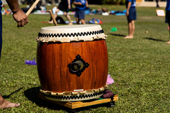 Taiko drum performance at a school event in a sunny outdoor setting