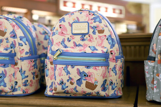 
Loungefly featuring characters from the movie *Lilo & Stitch*. Collectible Disney backpack