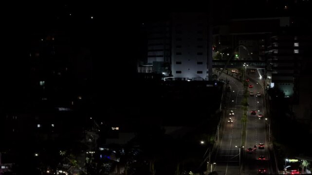 Aerial Night View of Urban Avenue With Flowing Traffic