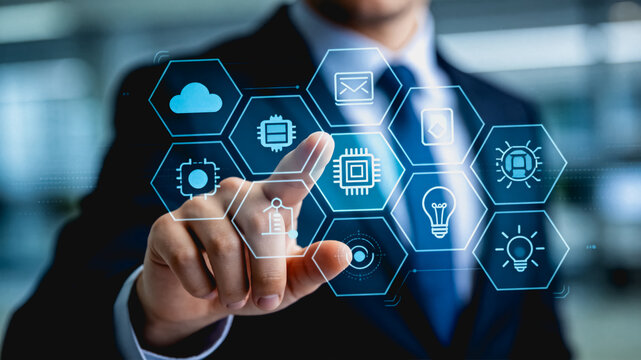 Businessman touching futuristic digital interface with tech icons
