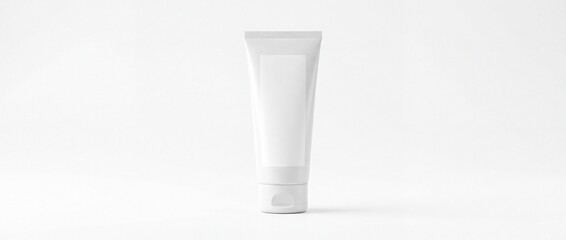 Blank white tube standing upright on plain white background © Fatima